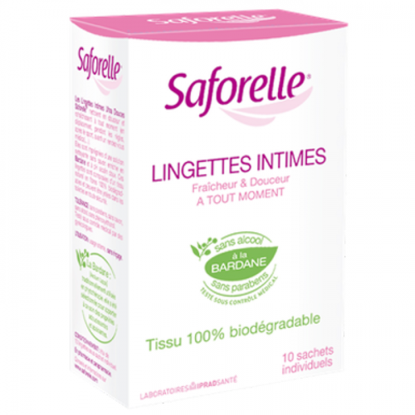 Une image d'une boîte de lingettes intimes Saforelle. La boîte est majoritairement blanche avec des accents et du texte roses. Il mentionne que les lingettes sont sans alcool, sans paraben et fabriquées avec des tissus biodégradables. La boîte contient 10 sachets individuels et comporte un sceau vert soulignant la présence d'extrait de bardane.