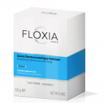 Boîte de Savon Dermocosmétique Exfoliant Floxia Paris dans un packaging blanc et bleu clair ; étiqueté pour l'hyperpigmentation, les troubles de la pigmentation. L'emballage indique que le savon pèse 125 g (4,4 oz) et comporte un texte noir avec le logo Floxia sur le dessus.