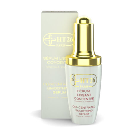 L'image montre un flacon blanc et or de « HT26 Paris Sérum Lissant Concentré » (Sérum Lissant Concentré) avec sa boîte assortie en arrière-plan. L'emballage du produit est élégant, indiquant un produit de soin haut de gamme contenant des vitamines A et E.