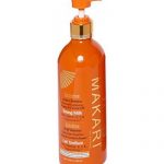 Une bouteille orange de lait tonique intense Makari Extreme Active avec un distributeur à pompe. La bouteille comporte un texte soulignant l’inclusion d’huile de carotte et d’argan, de vitamines E, C et D-Panthénol. Il comporte un texte de capacité de 16,8 fl oz / 500 ml sur le devant.