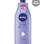 Un flacon violet de lotion hydratante Nivea labellisée "Lait Hydratant Douceur 48h Hydratation" avec une hydratation 48 heures pour les peaux sèches. Le flacon est doté d'un distributeur à pompe et contient 400 ml. Le texte indique « Maxi Format » et « Nouveau 48h Hydratation Intense » en haut.