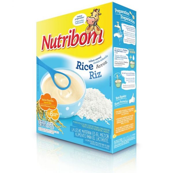 Une boîte colorée de céréales pour nourrissons Nutribom au goût de riz est présentée. La boîte présente une image des céréales dans un bol bleu avec une cuillère et des grains de riz à côté. Un texte pédagogique et des icônes illustrent la méthode de préparation. Le texte de l'emballage est en espagnol et en français.