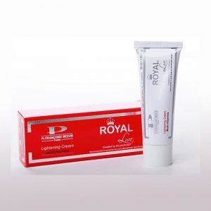 L'image montre un tube blanc de crème éclaircissante royale P. Françoise Bedon Paris positionné à côté de sa boîte de produits rouge et blanche. La boîte présente le nom de la marque et les détails du produit, soulignant son objectif d'éclaircir la peau.