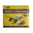 L'image montre une boîte de gingembre instantané Bonte Divine avec du miel et du thé au corossol. La boîte est marron et jaune et présente une tasse de thé fumante avec du gingembre, du nid d'abeille et un fruit de corossol au premier plan. La boîte contient 20 sachets et pèse 18g.