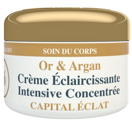 Un pot blanc et doré étiqueté « Or & Argan Crème Éclaircissante Intensive Concentrée » avec le texte français supplémentaire « SOIN DU CORPS » et « CAPITAL ÉCLAT ». Le pot semble être un produit de soin du corps contenant des ingrédients d’or et d’argan pour un éclaircissement intensif.