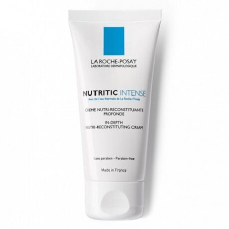 Un tube blanc de Crème Nutri-Reconstituante Intense Nutritic La Roche-Posay. Le texte sur le tube indique qu'il est sans paraben et fabriqué en France. Le produit est conçu pour nourrir en profondeur et reconstituer la peau.