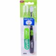 L'image montre une brosse à dents GUM Aktivital Sonic dans son emballage. L'emballage est principalement vert et blanc, sur lequel est écrit « 50 % d'efficacité en plus ». La brosse à dents est noire, fonctionne sur piles et est étiquetée « douce ». L'emballage comprend la marque SUNSTAR.