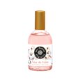 Un flacon d'Eau de Toilette "Les Petits Plaisirs" au parfum "Fleur de Coton". La bouteille est transparente avec un liquide rose à l'intérieur et un bouchon doré. L'étiquette présente un graphisme de fleurs de coton et l'information produit « Made in France ».