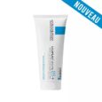 Un tube blanc de La Roche-Posay Cicaplast Baume B5+ avec un lettrage bleu et un carré bleu près du sommet. Le tube est légèrement incliné vers la gauche et une bannière diagonale bleue avec « NOUVEAU » est placée dans le coin supérieur droit.