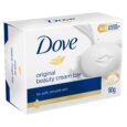 Une boîte de 90 g de barre de crème de beauté Dove Original est représentée. L'emballage est blanc et bleu avec le logo Dove, un symbole de colombe dorée et le texte « 3 en 1 nettoie, hydrate, nourrit ». Il est approuvé dermatologiquement et conçu pour une peau douce et lisse.