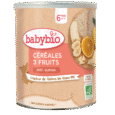 Un contenant cylindrique de céréales Babybio étiquetées « Céréales 3 Fruits avec Quinoa » pour les nourrissons de 6 mois et plus. L'étiquette montre des images de bananes, d'oranges et de quinoa. Le produit est biologique, fabriqué en France et annoncé comme étant sans sucres ajoutés.
