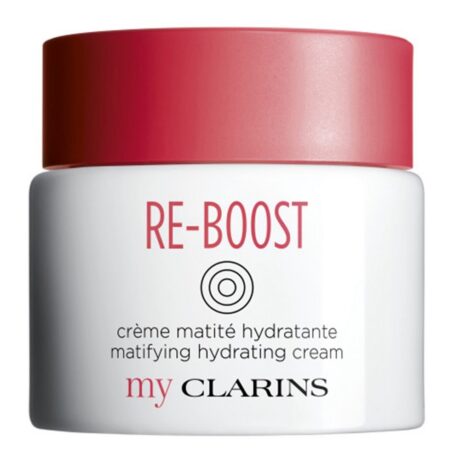 Un pot blanc avec un couvercle rouge étiqueté « CLARINS Crème Matité Hydratante Peaux Mixtes À Grasses 50ml » en texte rouge. Ci-dessous, le texte indique « crème matité hydratante matifying hydrating cream » et « my CLARINS » en caractères plus petits en bas. Le design comporte un logo circulaire entre le nom du produit et la description.