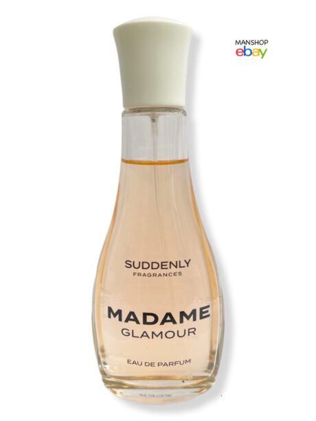 une bouteille d'eau de parfum madame glamour de soudain fragrances est exposée. le flacon en verre transparent révèle un liquide légèrement ambré à l'intérieur, avec un bouchon blanc. le logo manshop ebay est visible dans le coin supérieur droit.