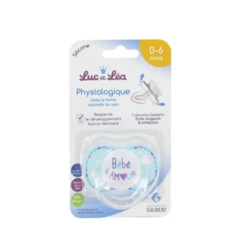 image produit d'une sucette pour bébé luc et léa conçue pour les nourrissons de 0 à 6 mois. l'emballage met en valeur des caractéristiques telles que la forme anatomique, le matériau en silicone et le respect du développement dentaire. la sucette présente un motif en forme de cœur avec l'inscription « bébé d'amour » dessus.