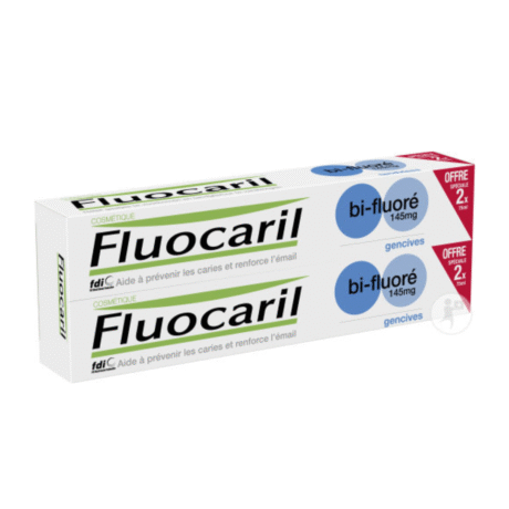 une boîte de dentifrice fluocaril bi fluoré, avec deux tubes visibles à l'intérieur. l'emballage est principalement blanc avec des touches de vert et de bleu, avec un texte en français sur les soins dentaires et le renforcement de l'émail.