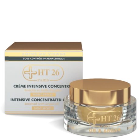 un pot de crème concentrée intensive ht26 paris est placé devant sa boîte d'emballage. le pot a une base transparente avec un couvercle doré, et la boîte présente des éléments de design dorés et blancs assortis. la crème est enrichie en huile d'argan.