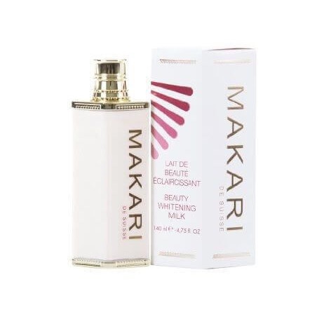 une bouteille de makari de suisse beauty whitening milk est présentée à côté de sa boîte assortie. la bouteille présente un design blanc et doré avec des accents décoratifs. le texte sur l'emballage est en français et en anglais.