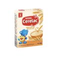 boîte de céréales pour nourrissons nestlé cerelac wheat with milk. l'emballage présente un ours bleu, un bol de céréales avec une cuillère et des illustrations de blé. convient aux nourrissons à partir de 6 mois. poids : 250 g.