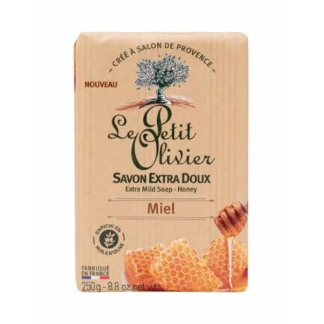 savon rectangulaire le petit olivier dans un emballage beige. le design présente des images de nid d'abeilles et une cuillère à miel. le texte en français le décrit comme "savon extra doux miel", enrichi à l'huile d'olive, pesant 250 g.