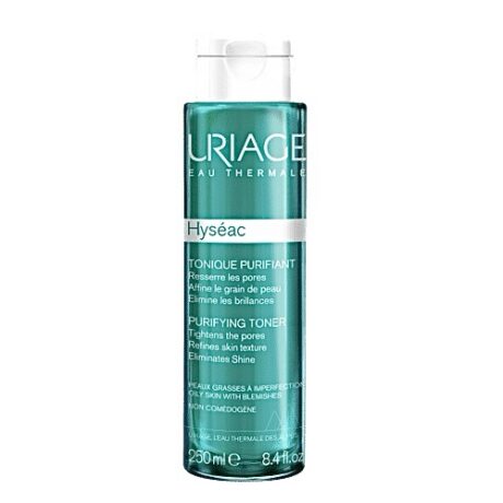 flacon cylindrique transparent de lotion purifiante hyseac d'uriage au liquide turquoise. l'étiquette détaille ses bienfaits pour resserrer les pores, affiner la texture et éliminer la brillance. le flacon contient 250 ml.