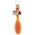 brosse à cheveux en plastique orange avec des poils blancs et des pointes orange, emballée avec un petit peigne blanc sur le dessus. l'étiquette indique "titania professional haircare" et comporte une photo de femme.