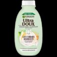 un flacon vert du shampooing hydratant garnier ultra doux au lait d'amande et à la sève d'agave, labellisé pour les cheveux déshydratés. le flacon met en valeur les extraits naturels et l'emballage écologique et recyclable.