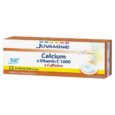 une boîte de juvamine calcium & vitamine c 1000 avec caféine en comprimés effervescents, sans sucre, arôme naturel d'orange, contenant 15 comprimés. l'emballage montre également des bulles effervescentes dans un verre.