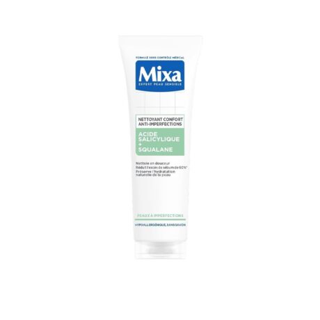 tube blanc de mixa nettoyant confort anti imperfections, nettoyant visage à l'acide salicylique et au squalane, conçu pour les peaux sensibles, se tenant debout sur un fond blanc uni.