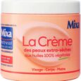 un pot de couleur pêche de mixa la crème pour peaux extra sèches, étiquetée comme hypoallergénique et contenant 100% d'huiles végétales. convient pour le visage, le corps et les mains. le texte de l'étiquette est en français.