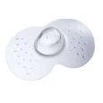 une téterelle en silicone transparente avec des points texturés et un centre en forme de dôme, conçue pour soutenir l'allaitement.